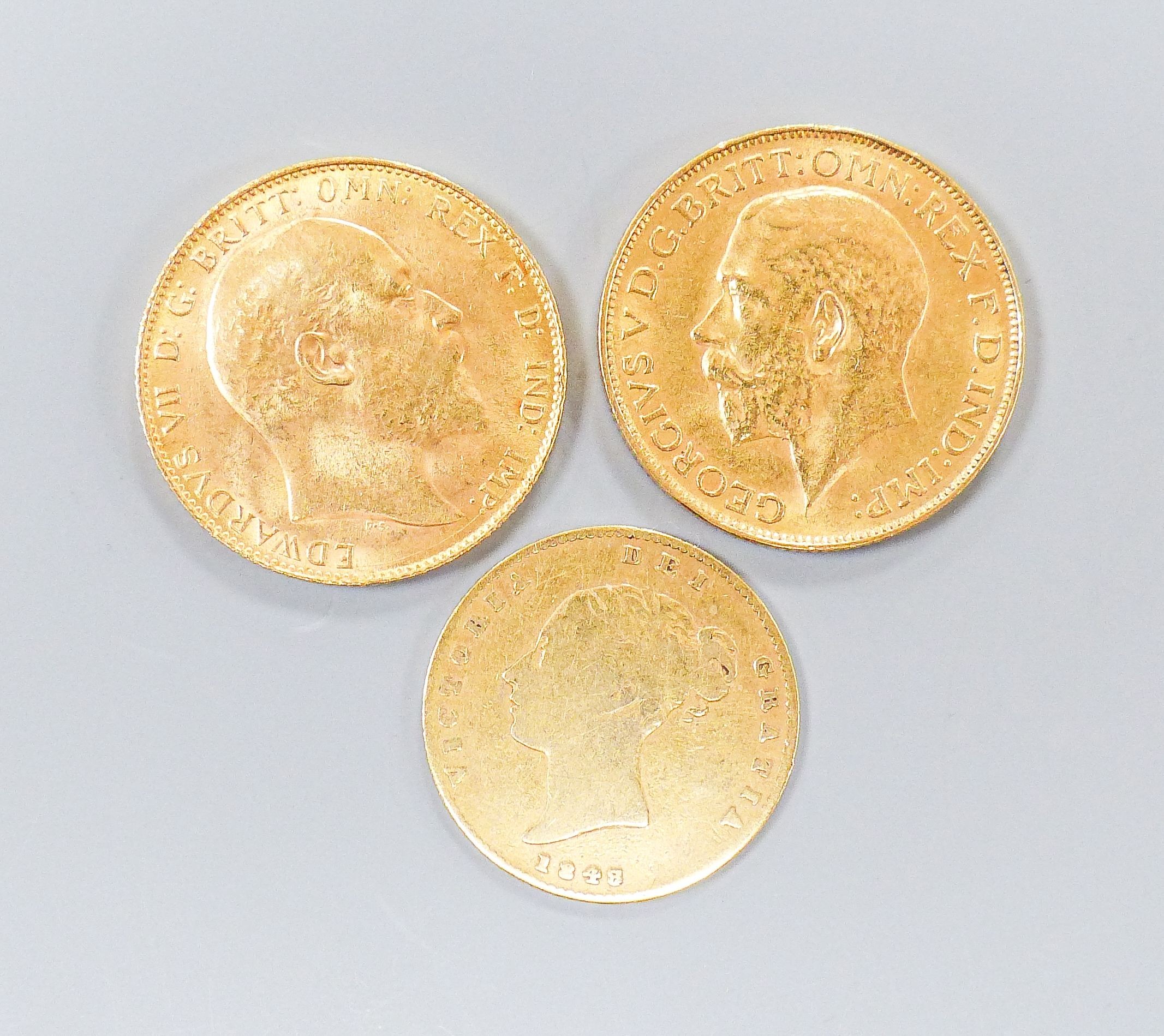 An Edward VII gold sovereign, 1907, a George V sovereign, 1926 and a Victoria half-sovereign, 1848 (worn)